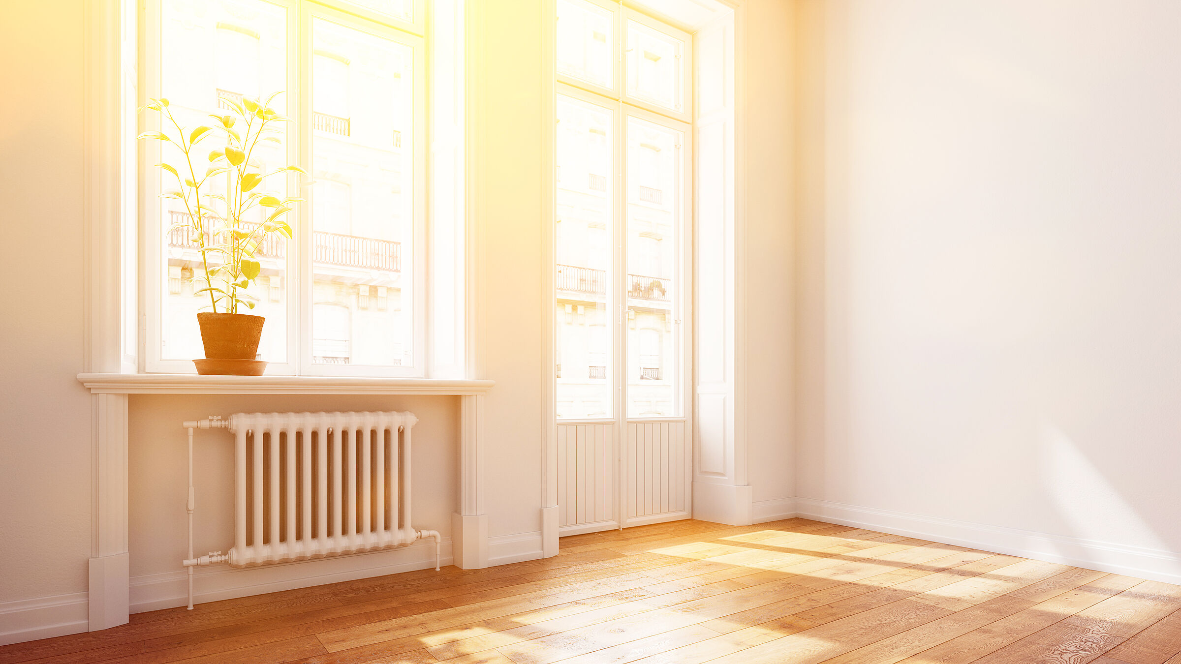 Richtig heizen: Ein Heizkörper in einer sonnendurchfluteten Altbauwohnung. (Foto: Robert Kneschke/stock.adobe.com)